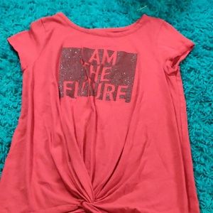 A red shirt with a tie in the stomach